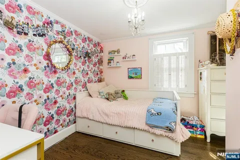 a bedroom with bed and a window