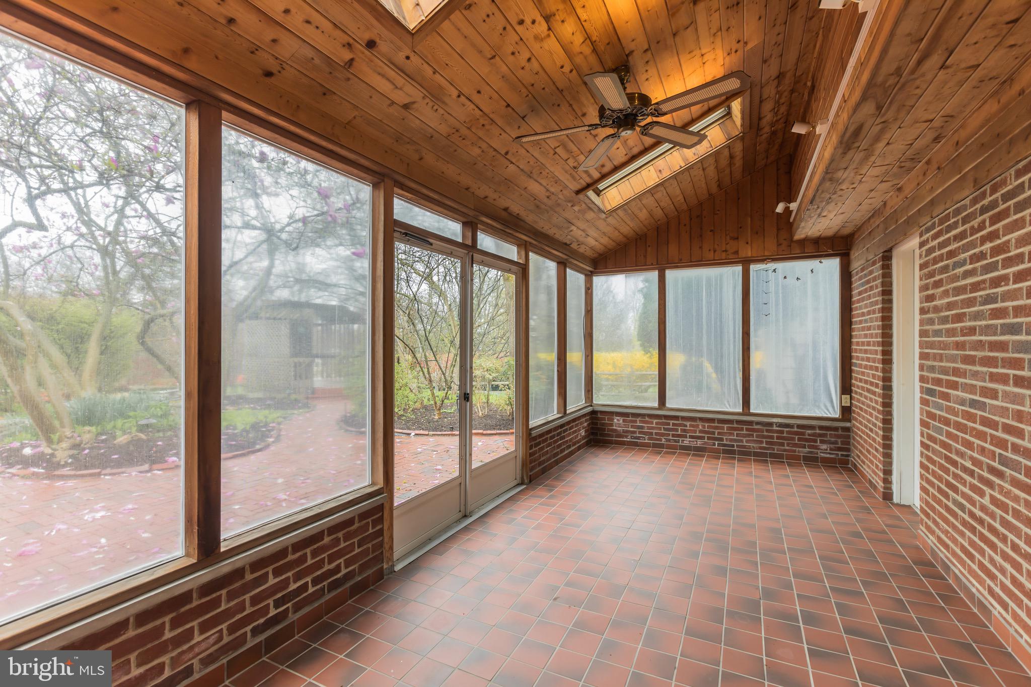 2931 Eagleville Road Eagleville, PA 19403 - Photo 23 of 46 Screened Porch with Cedar ceiling & skylights.