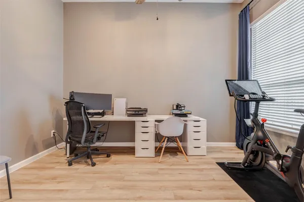 a workspace with furniture and wooden floor