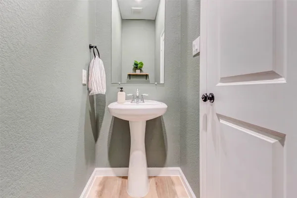 a bathroom with a sink and mirror