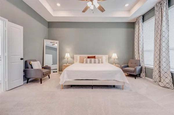 a bedroom with bed and a couch