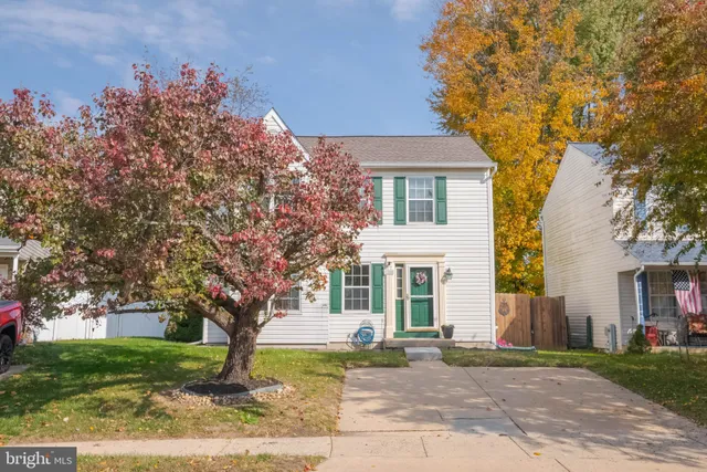 front view of a house with a trees