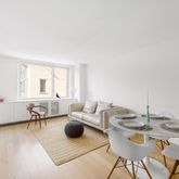 a living room with furniture and a table