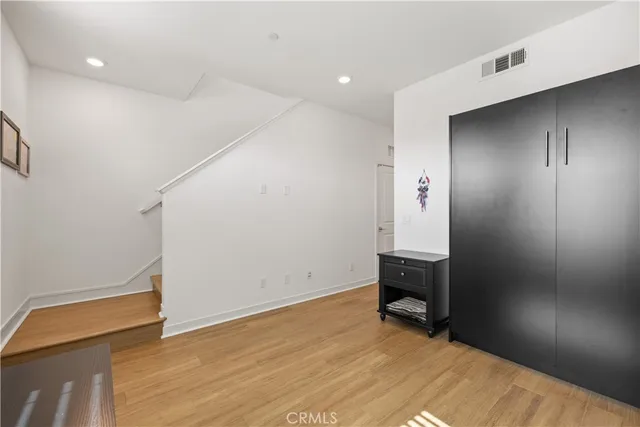 a view of a livingroom with wooden floor