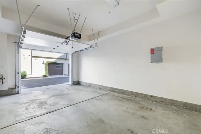 en empty room with wooden floor and window