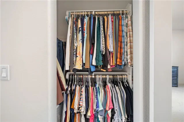 a bedroom with a bed and dresser