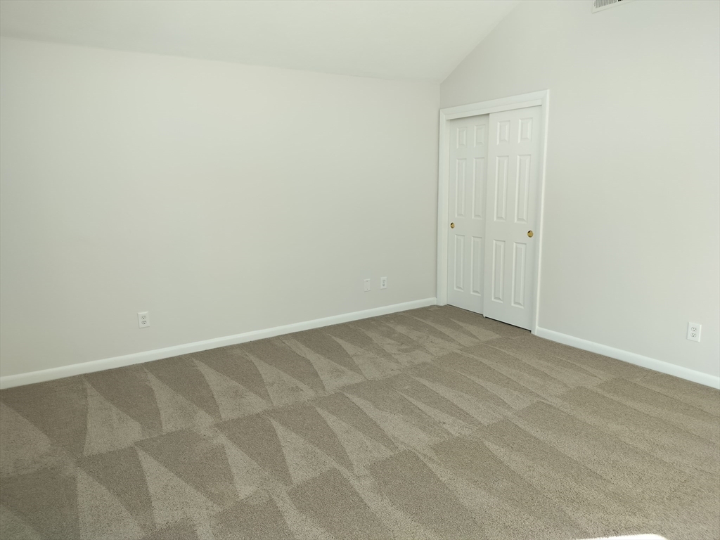 75 Warren Street West, Unit 16 Raynham, MA 02767 - Photo 17 of 22 a view of an empty room