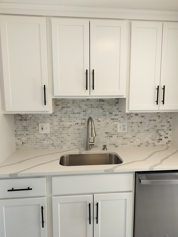 75 Warren Street West, Unit 16 Raynham, MA 02767 - Photo 3 of 22 a kitchen with a sink and cabinets