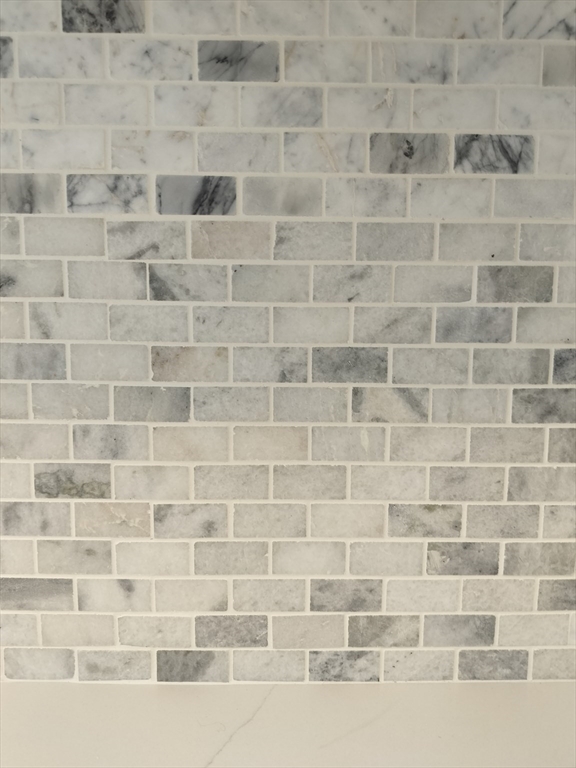 75 Warren Street West, Unit 16 Raynham, MA 02767 - Photo 5 of 22 a bathroom with a shower