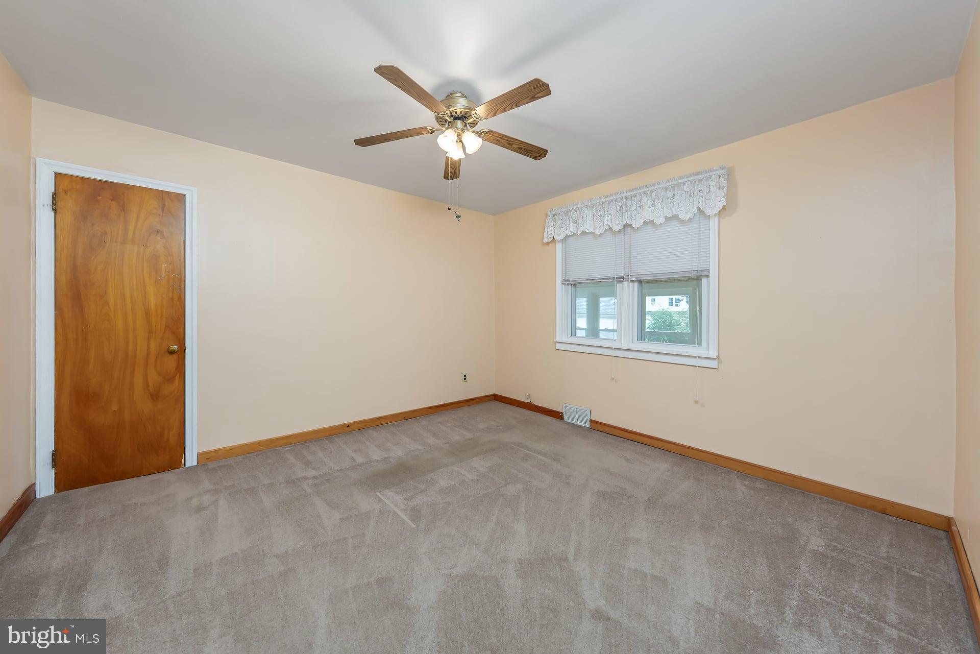 2008 Sycamore Street Haddon Heights, NJ 08035 - Photo 12 of 17 an empty room with a window and a ceiling fan