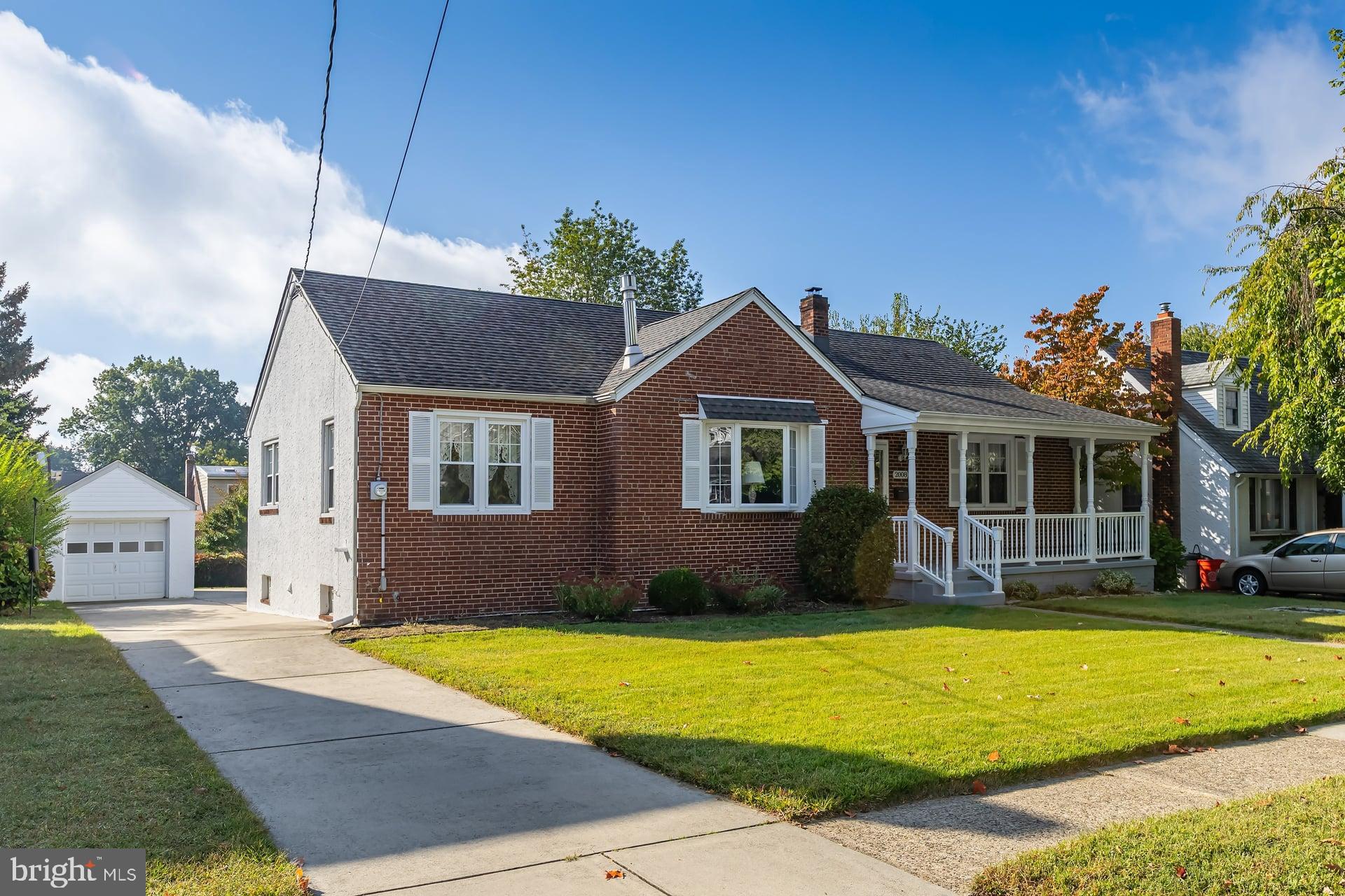 2008 Sycamore Street Haddon Heights, NJ 08035 - Photo 2 of 17 a front view of a house with a yard