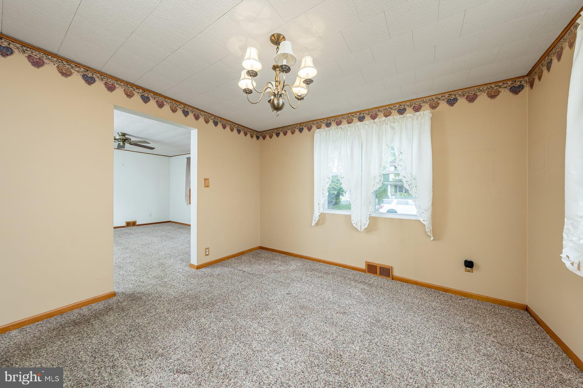 2008 Sycamore Street Haddon Heights, NJ 08035 - Photo 5 of 17 an empty room with windows and chandelier