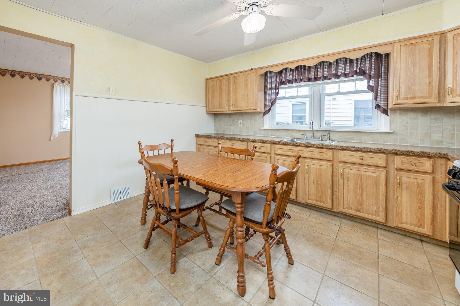 2008 Sycamore Street Haddon Heights, NJ 08035 - Photo 8 of 17 a kitchen with a table and chairs in it
