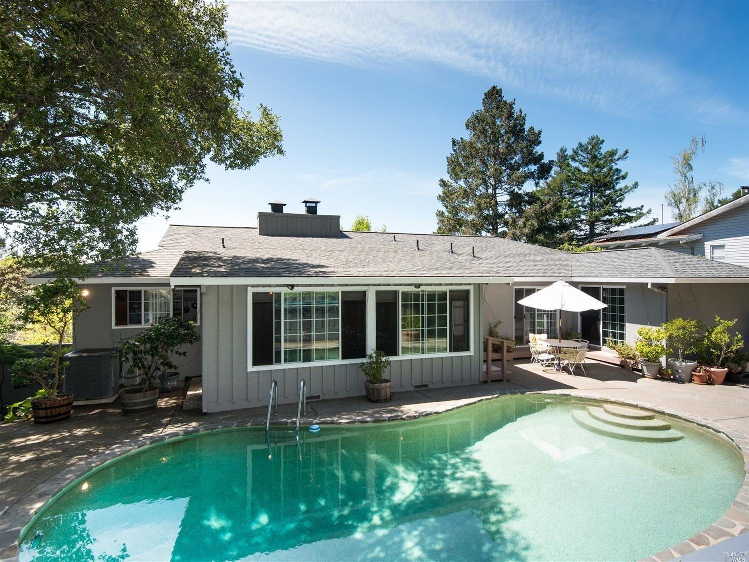 8 Rustic Way San Rafael, CA 94901 - Photo 1 of 1 a front view of a house with a yard and porch