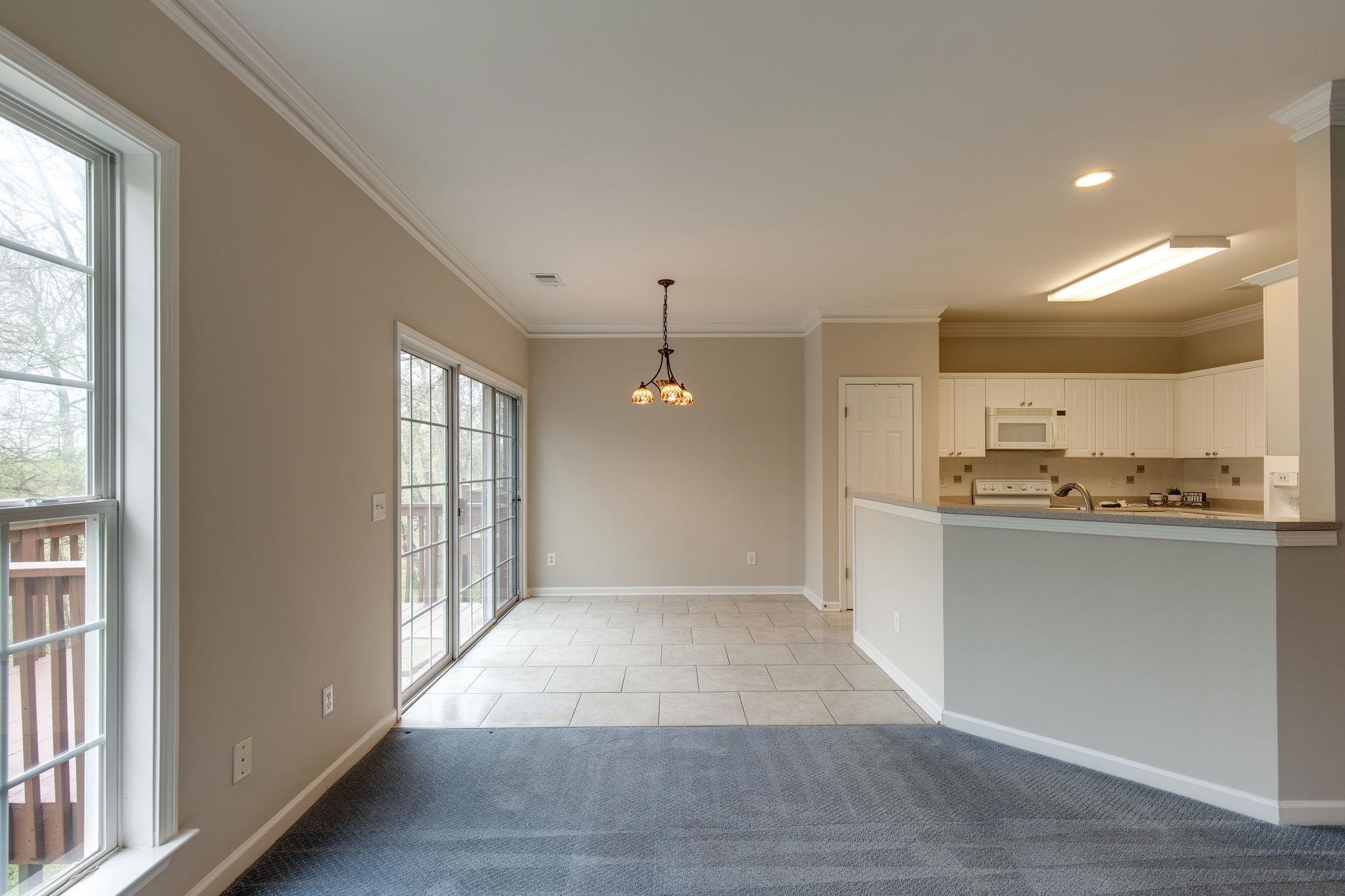 231 Green Harbor Road, Unit 92 Old Hickory, TN 37138 - Photo 11 of 30 a view of a kitchen with a sink and dishwasher kitchen view with wooden floor