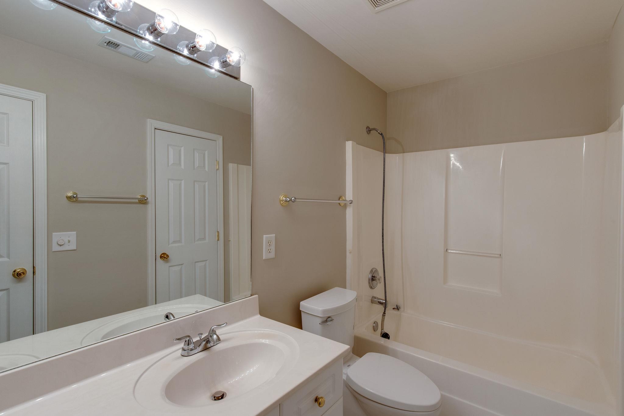 231 Green Harbor Road, Unit 92 Old Hickory, TN 37138 - Photo 17 of 30 a bathroom with a sink toilet and shower