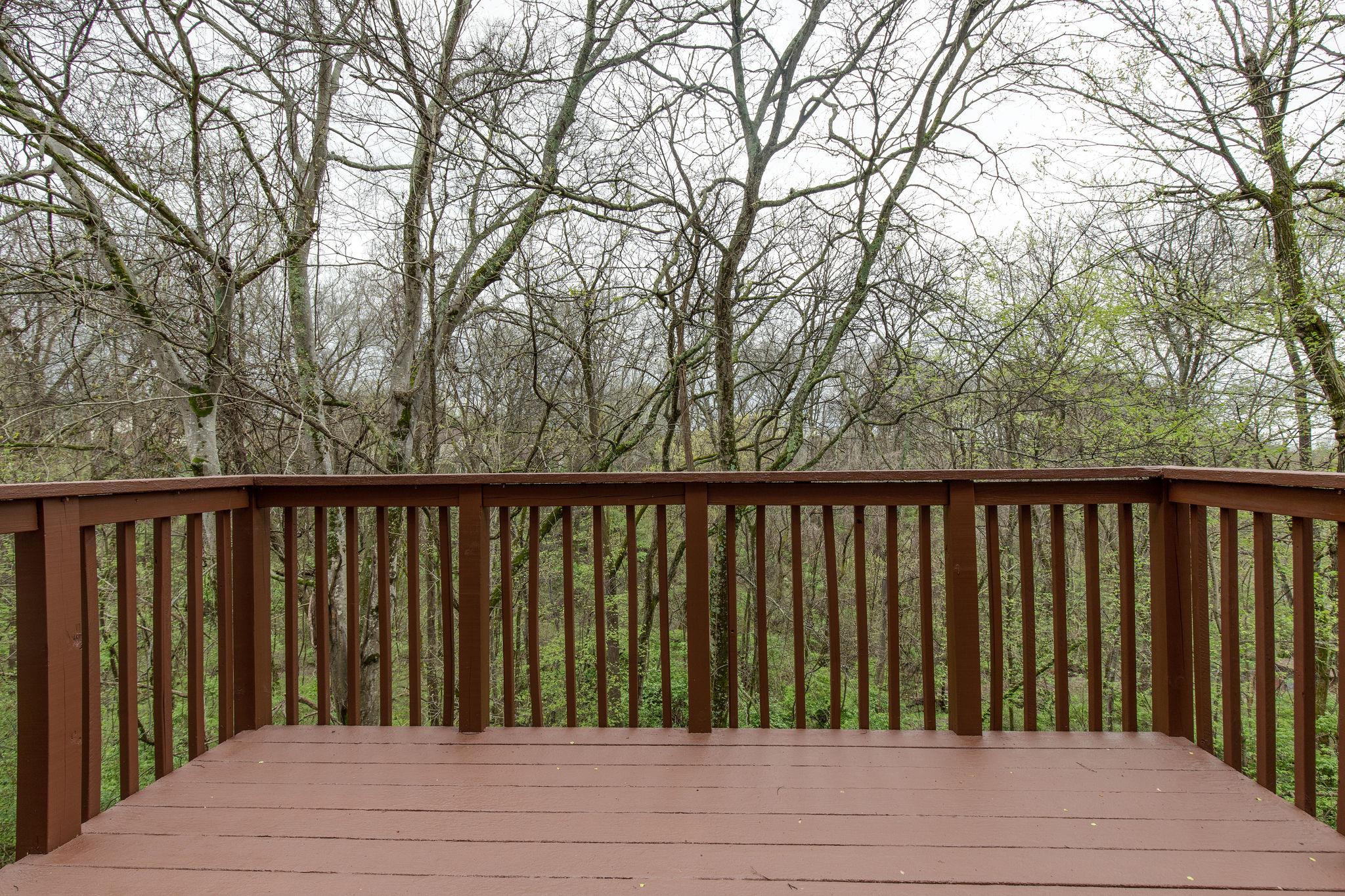 231 Green Harbor Road, Unit 92 Old Hickory, TN 37138 - Photo 26 of 30 a balcony with wooden floor and fence