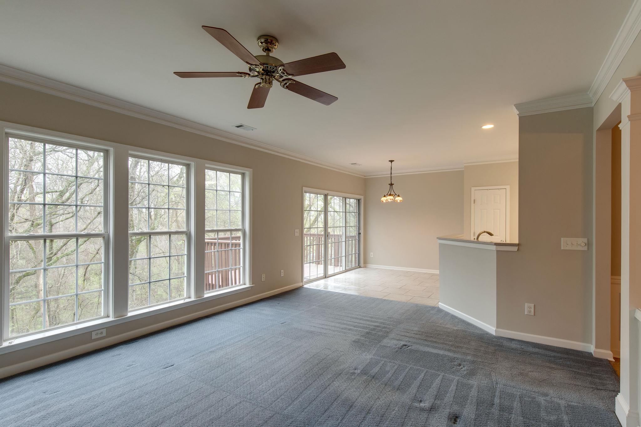 231 Green Harbor Road, Unit 92 Old Hickory, TN 37138 - Photo 9 of 30 a view of an empty room with a window and wooden floor