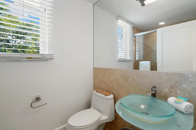 a bedroom with a bed and a lamp