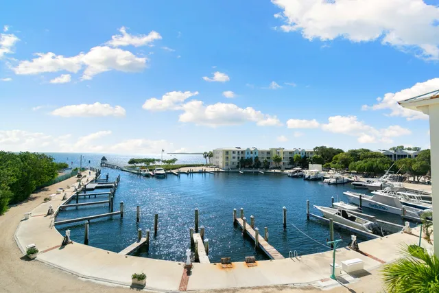 a view of swimming pool with outdoor seating and deck