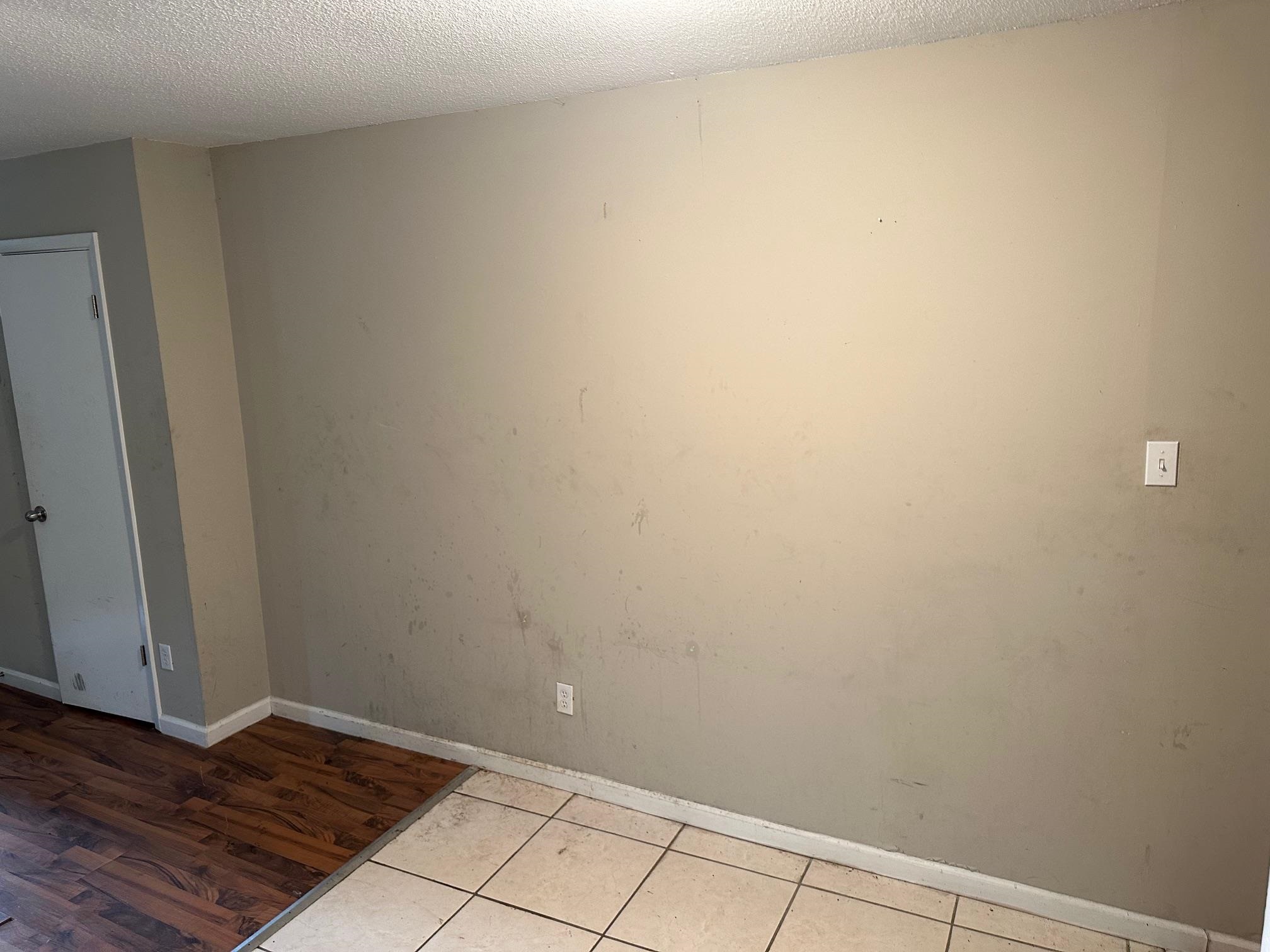 4423 Sumners Wells Road Memphis, TN 38118 - Photo 7 of 8 Spare room with light wood-type flooring and a textured ceiling