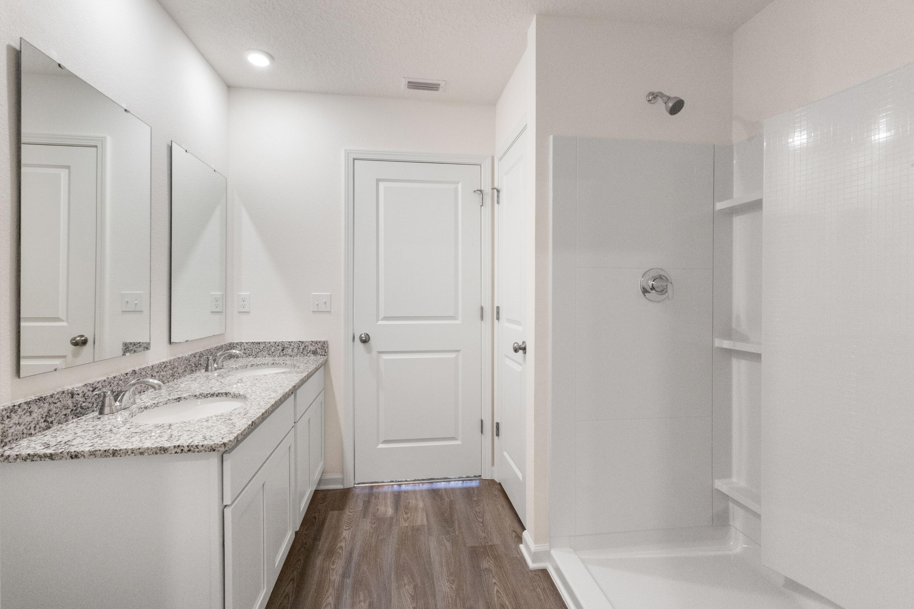 291 Cat Island Road DeFuniak Springs, FL 32433 - Photo 10 of 18 a bathroom with a granite countertop sink and a mirror