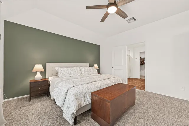 a bedroom with bed and window