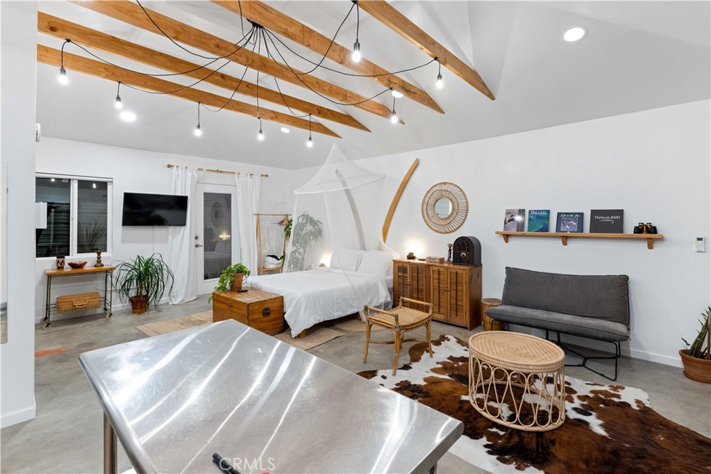 61879 Valley View Circle Joshua Tree, CA 92252 - Photo 49 of 63 a living room with furniture and a clock