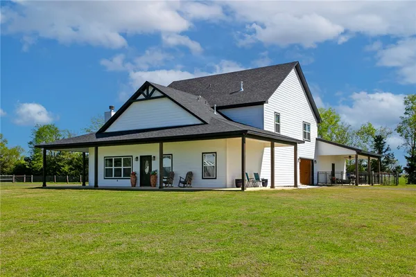 a living room with a fireplace and a flat screen tv