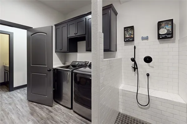a en suite bathroom with a sink double vanity and a mirror