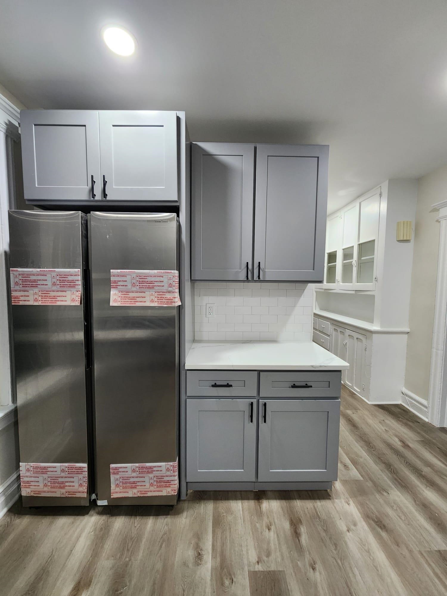 65 Halstead Street, Unit 2 Kearny, NJ 07032 - Photo 3 of 16 a kitchen with stainless steel appliances granite countertop a sink and a refrigerator