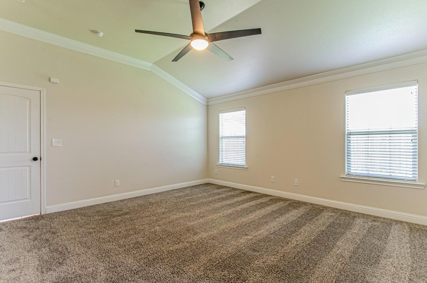 9105 Rochester Avenue Lubbock, TX 79424 - Photo 1 of 24 a view of an empty room with a window