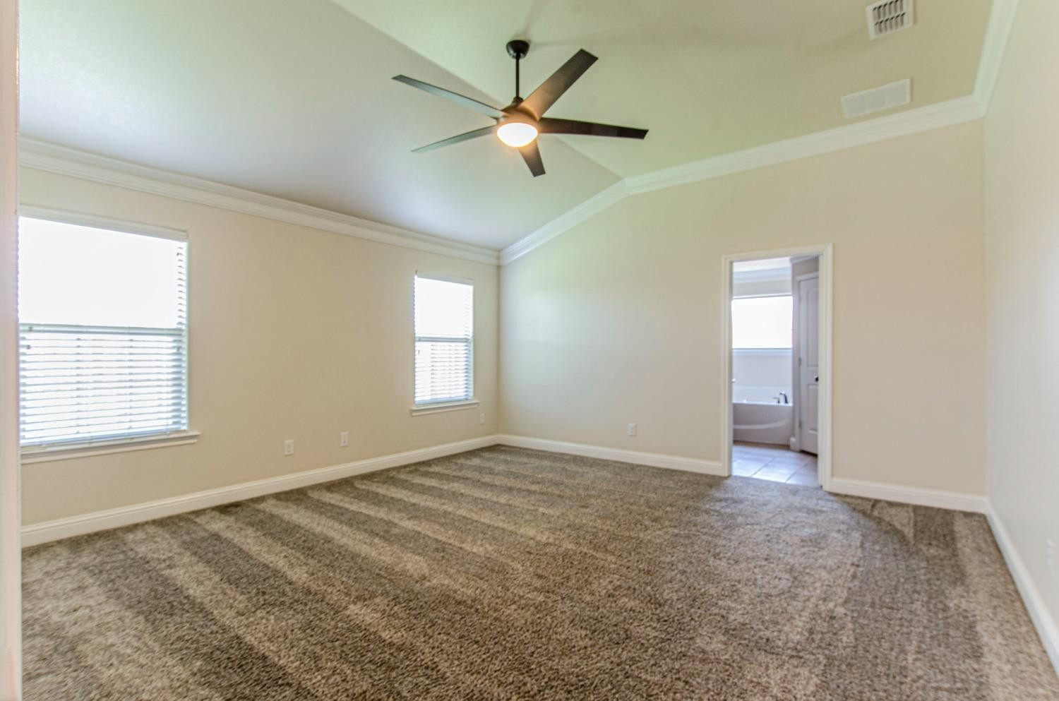 9105 Rochester Avenue Lubbock, TX 79424 - Photo 2 of 24 a view of an empty room with a window