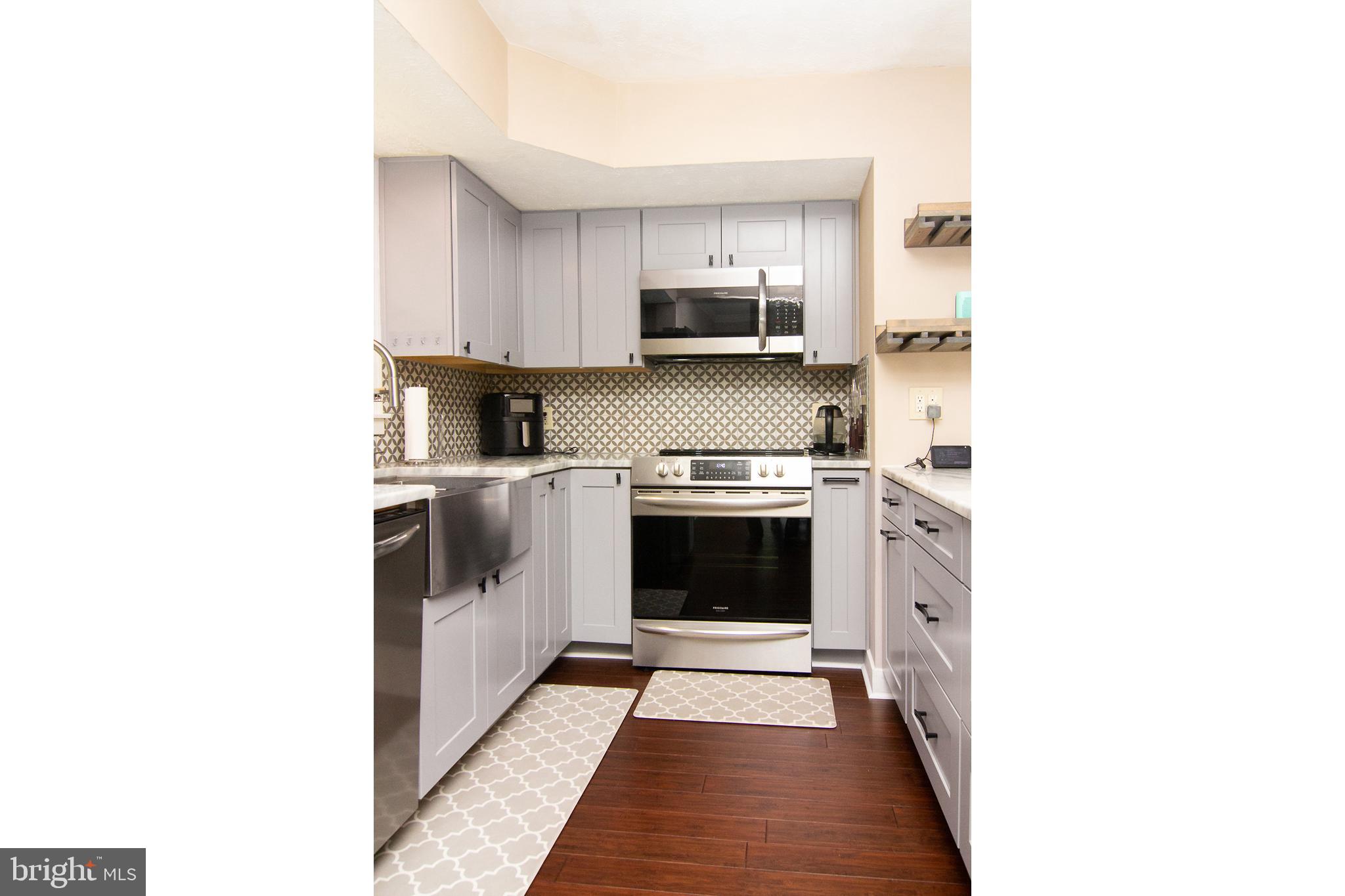 1827 Beth Bridge Circle Forest Hill, MD 21050 - Photo 12 of 48 a kitchen with stainless steel appliances a stove and a refrigerator