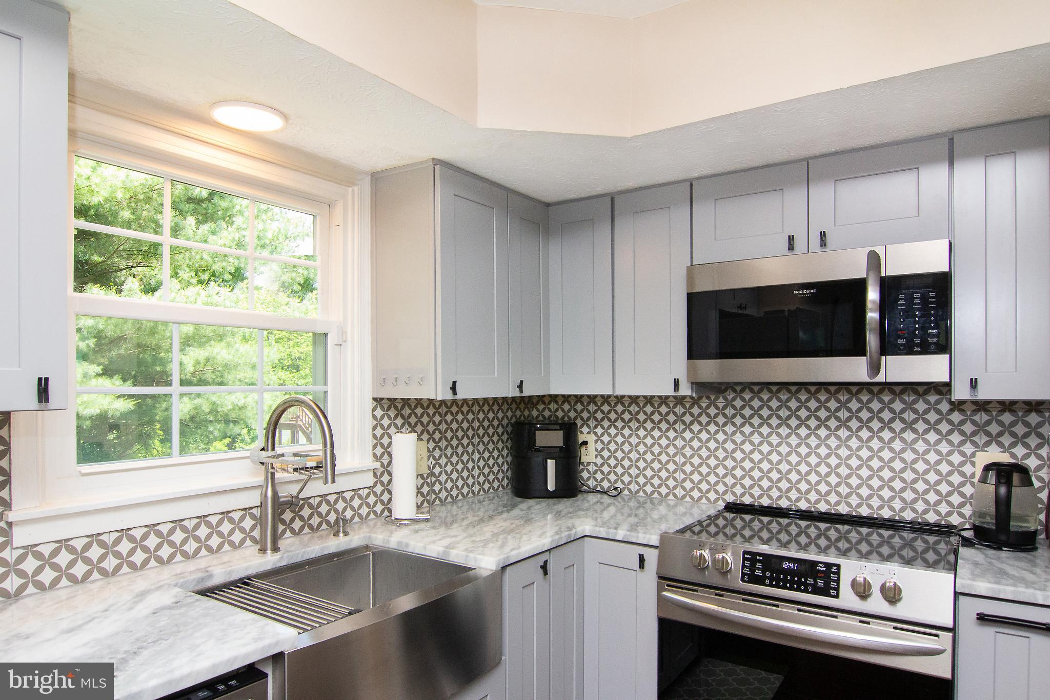 1827 Beth Bridge Circle Forest Hill, MD 21050 - Photo 14 of 48 a kitchen with a sink a stove and cabinets