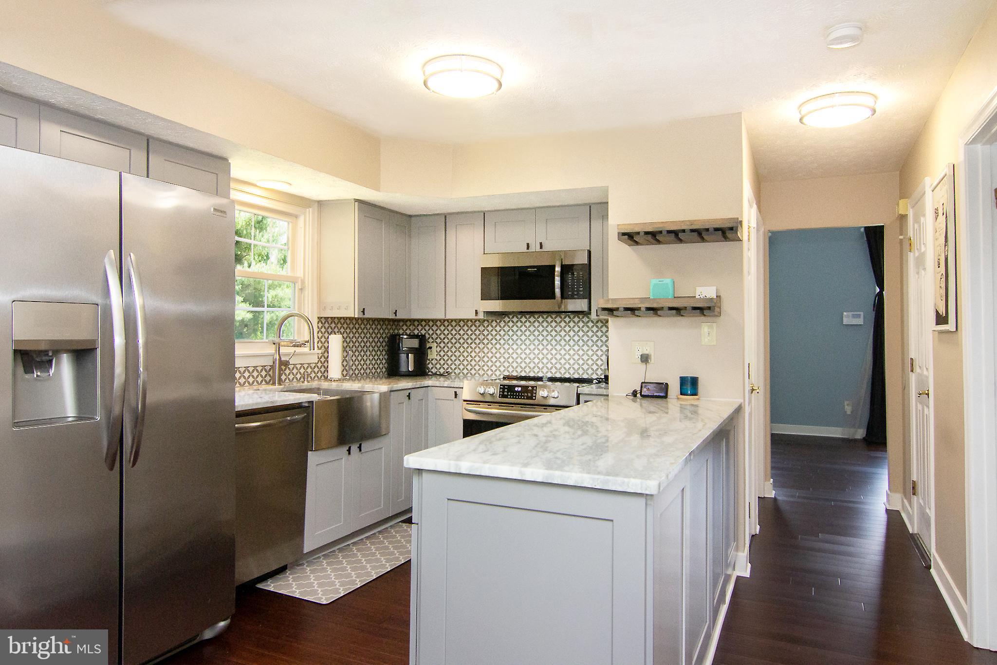 1827 Beth Bridge Circle Forest Hill, MD 21050 - Photo 9 of 48 a kitchen with stainless steel appliances granite countertop a refrigerator a stove and a sink