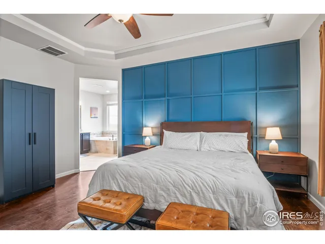 a bedroom with a bed and a cabinets