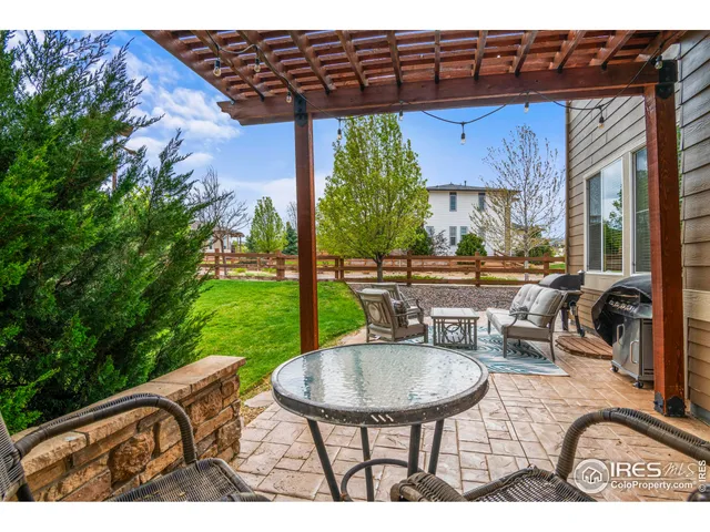 a view of a chairs and table in the patio