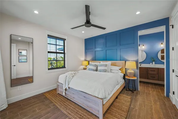 a bedroom with a bed and a view of en suite bathroom