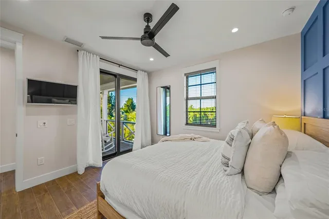 a bed room with a bed and a television