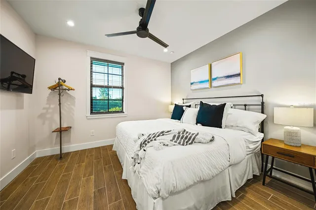 a bedroom with bed and window