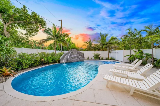 a view of a swimming pool with an outdoor space