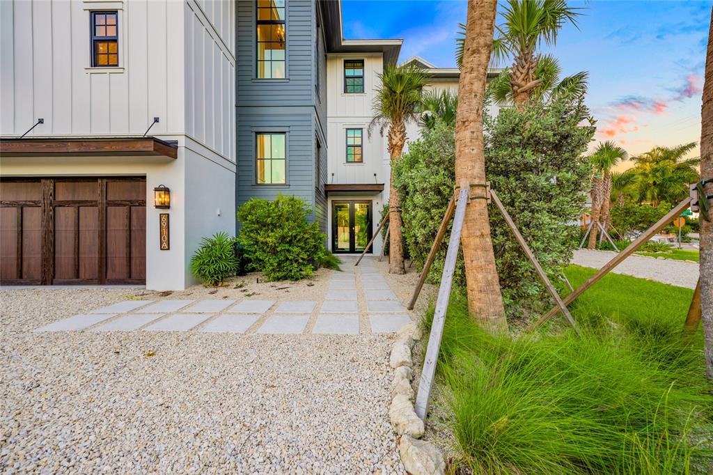 6910 Midnight Pass Road, Unit A Sarasota, FL 34242 - Photo 5 of 40 a view of a house with a yard