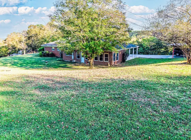 a view of a house with a yard