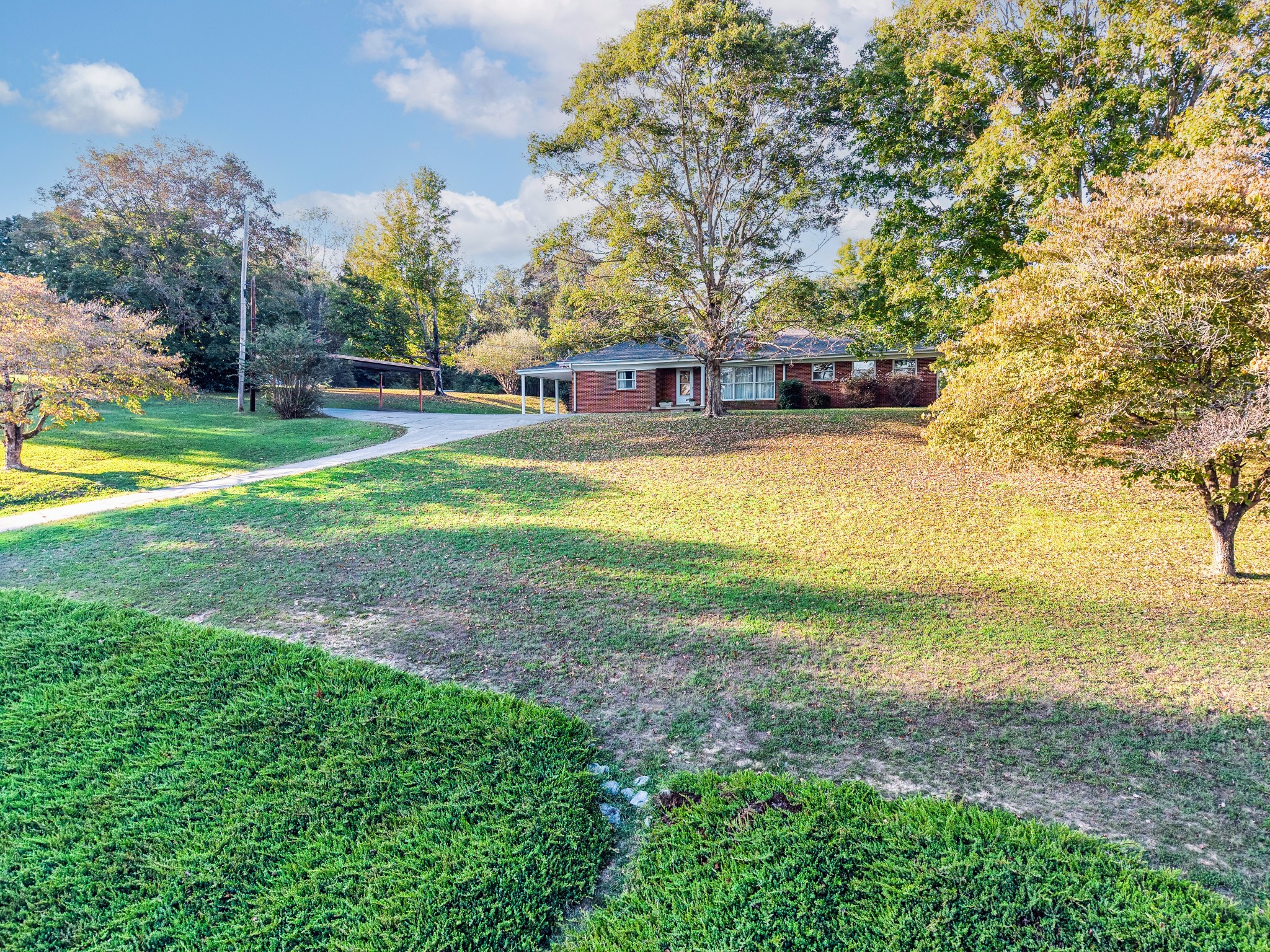 3241 West Main Street Erin, TN 37061 - Photo 22 of 22 a view of a yard with a house