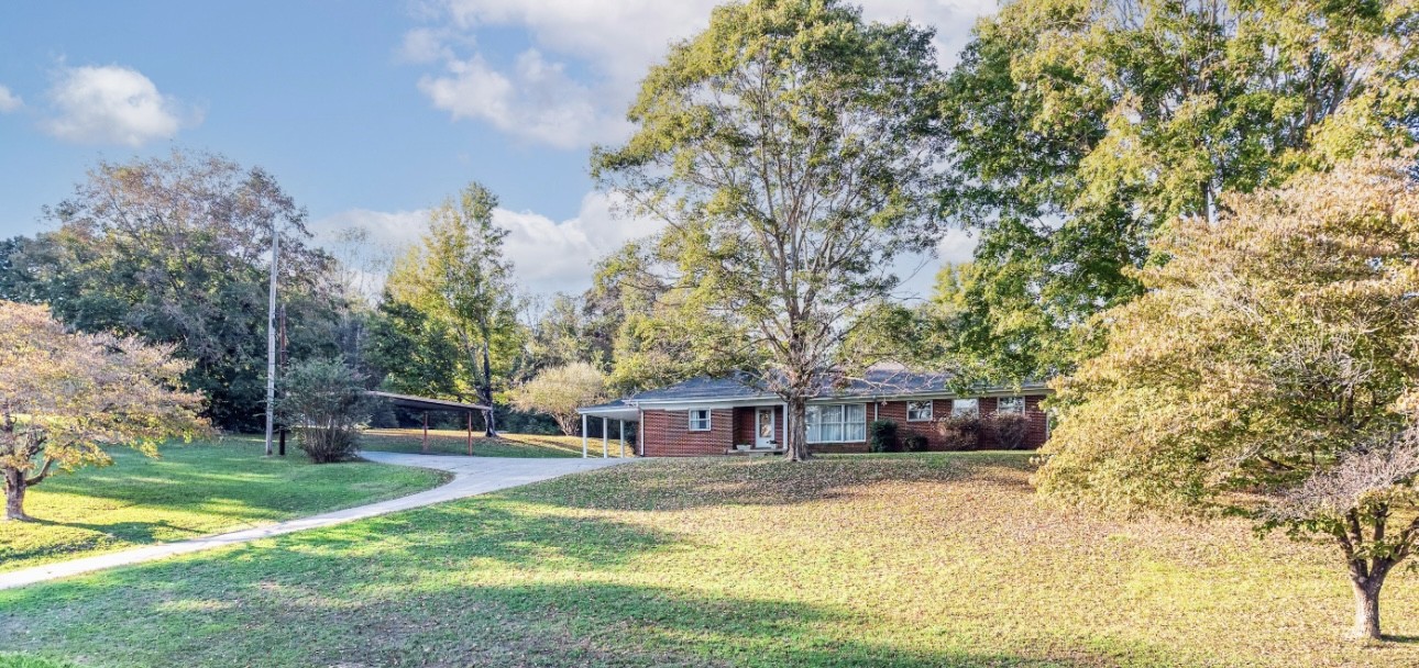 3241 West Main Street Erin, TN 37061 - Photo 3 of 22 a view of a house with a yard