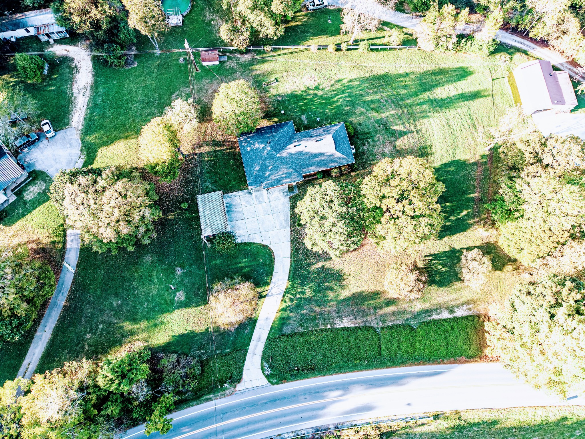 3241 West Main Street Erin, TN 37061 - Photo 4 of 22 an aerial view of a house with a yard and garden