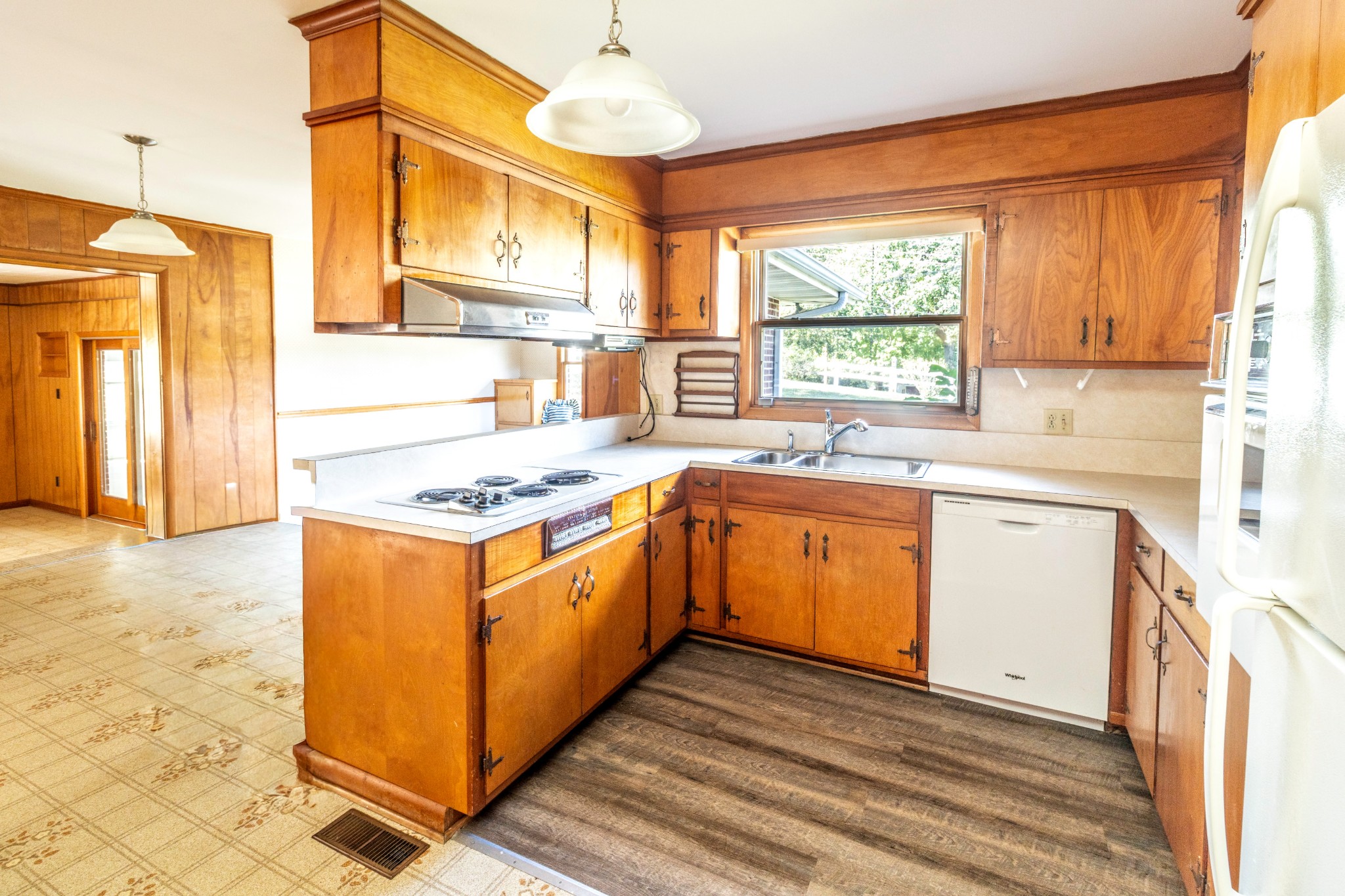 3241 West Main Street Erin, TN 37061 - Photo 7 of 22 a kitchen with stainless steel appliances granite countertop a sink a stove and a refrigerator