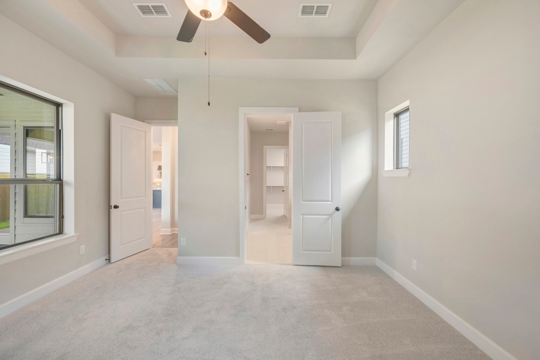 2722 Cottage Place Rosharon, TX 77583 - Photo 36 of 50 an empty room with chandelier fan and windows