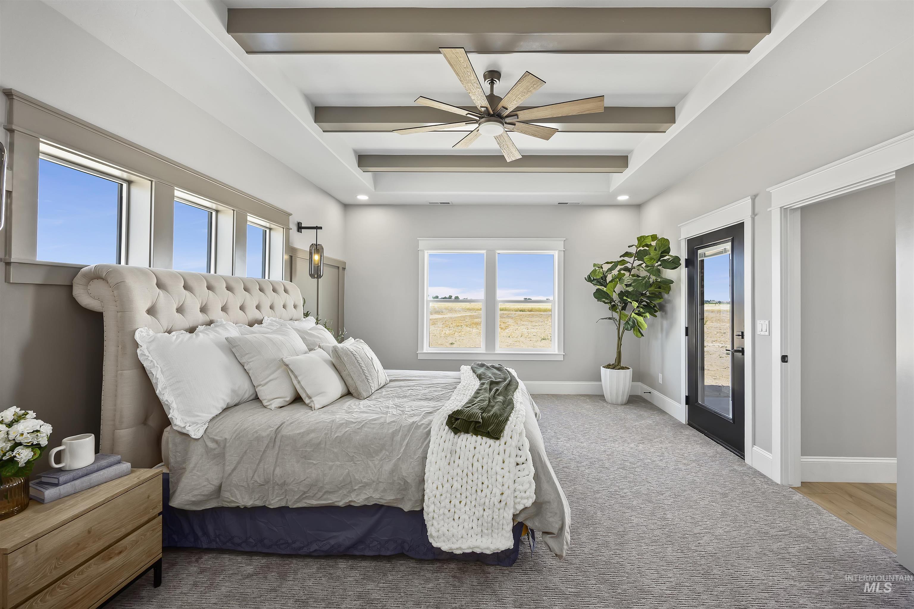 378 West 100 South Rupert, ID 83350 - Photo 22 of 50 Spacious bedroom featuring a tray ceiling with exposed wood-finish beams, a ceiling fan, and recessed lighting